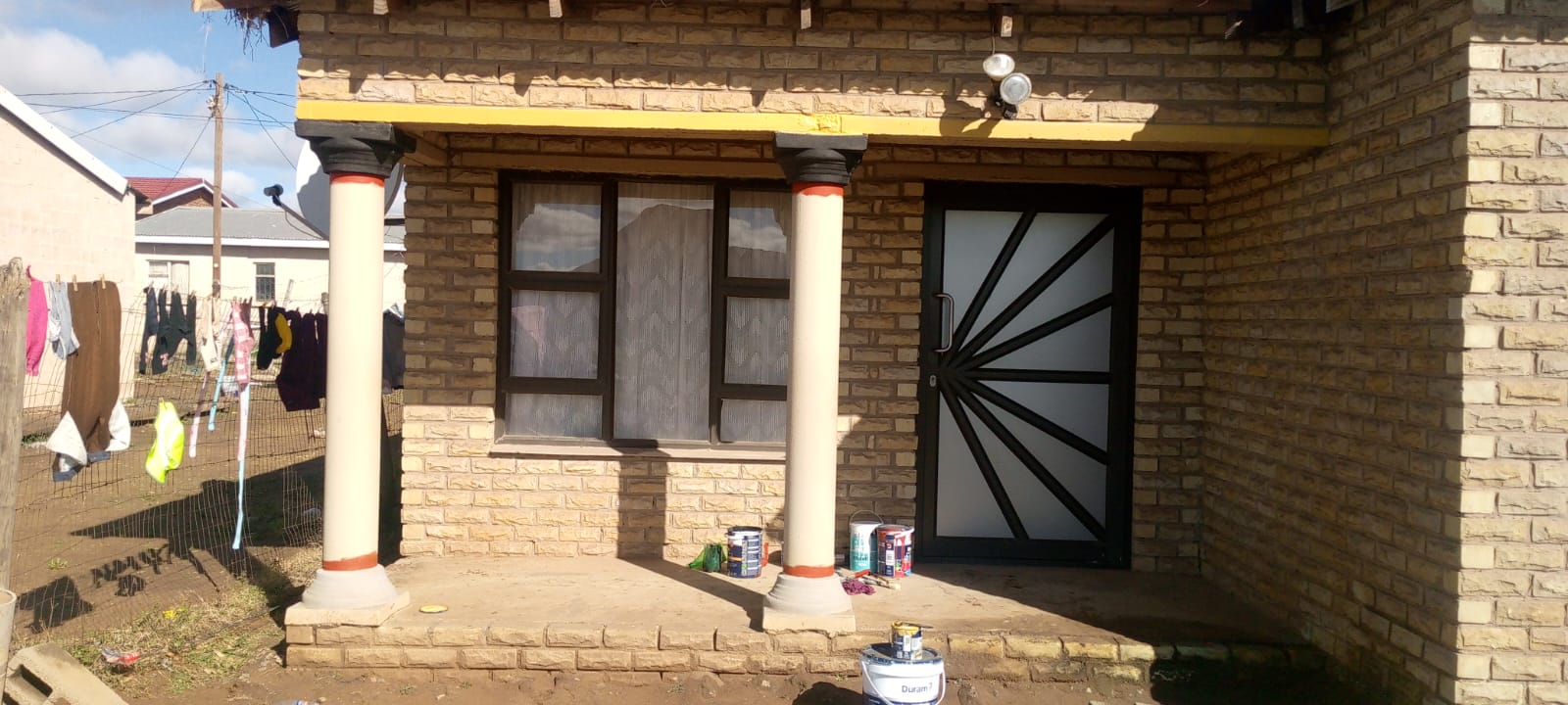 Residential property with freshly painted pillars and new security door
