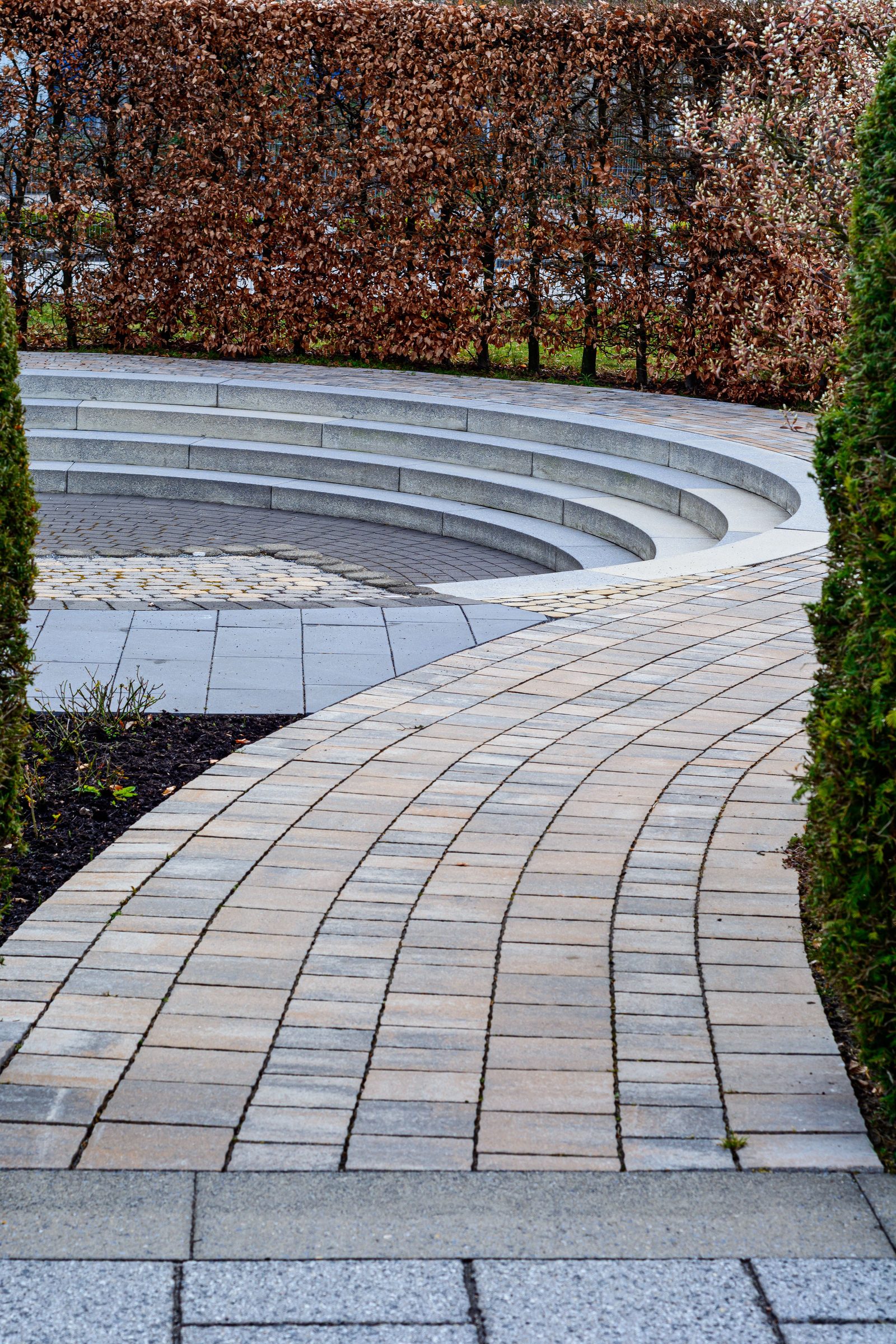 Curved brick paving pathway