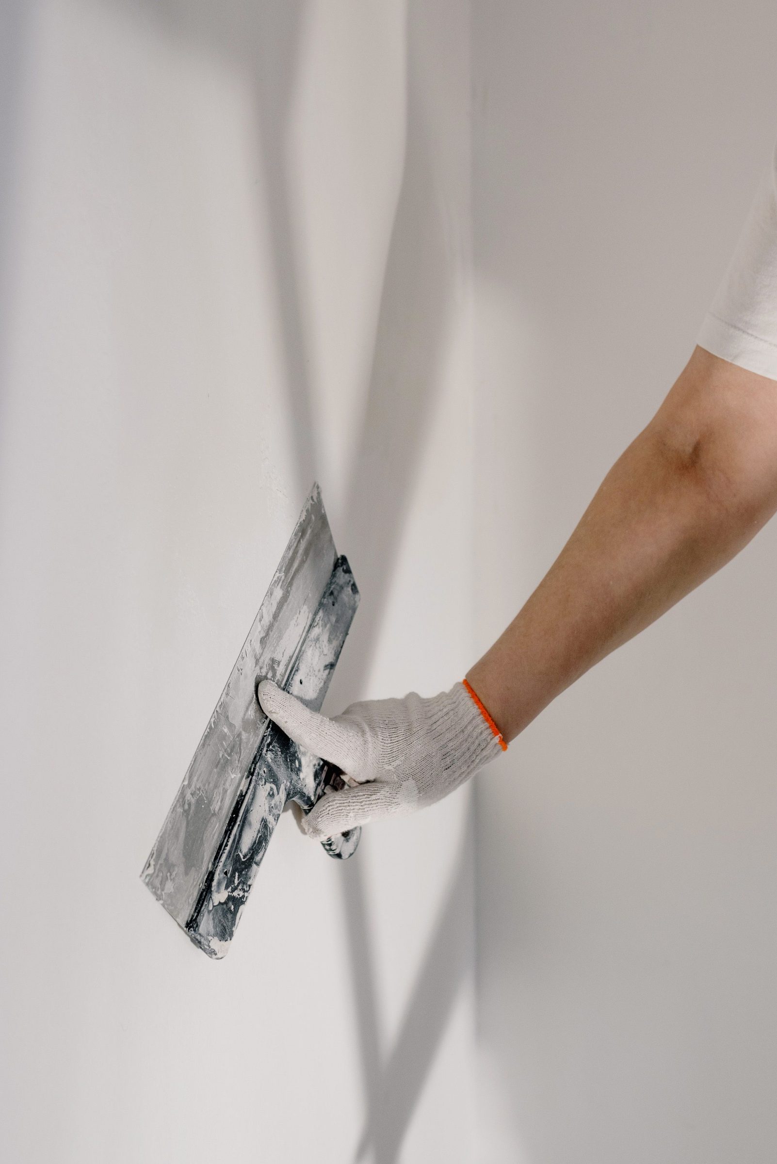 Skilled worker applying plaster to a wall